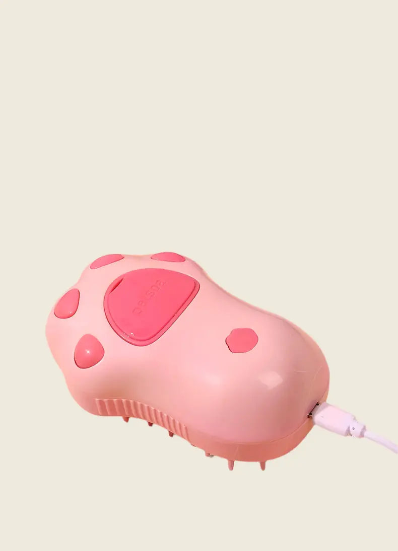 PatteVapeur pink appliance with paw design and USB connection.