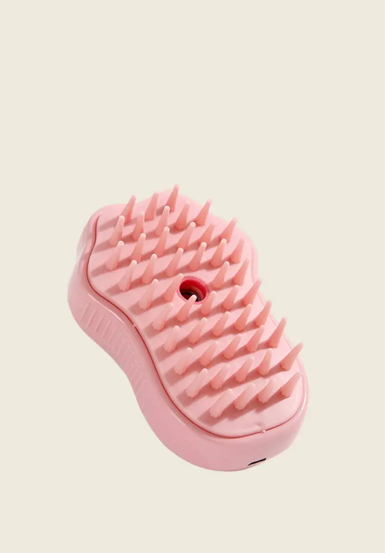 PatteVapeur pink spiky massage tool on beige background.