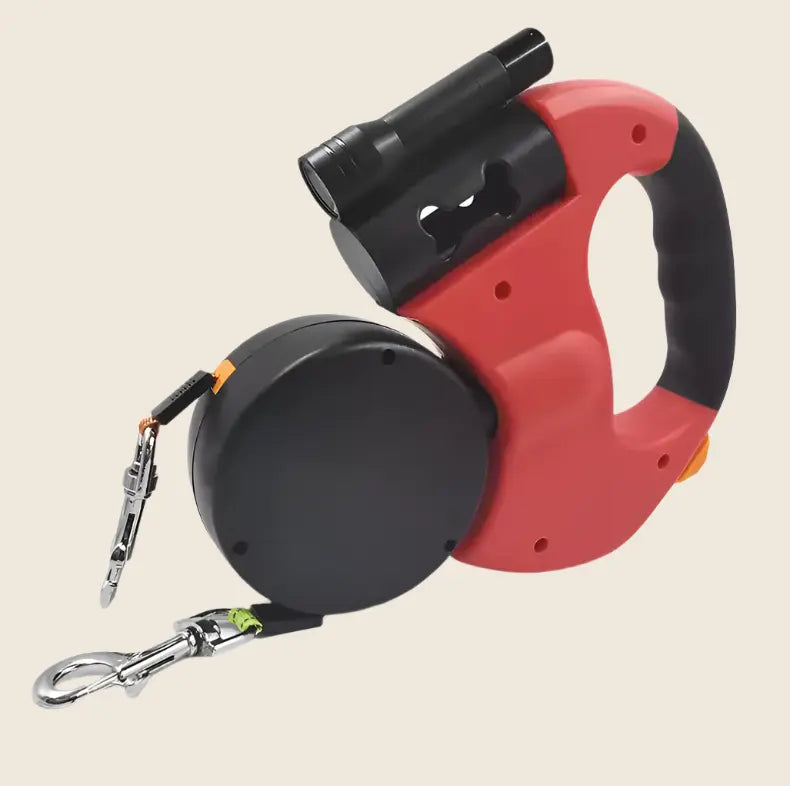 Laisse rétractable anti-enchevêtrement rouge et noire avec poignée ergonomique.