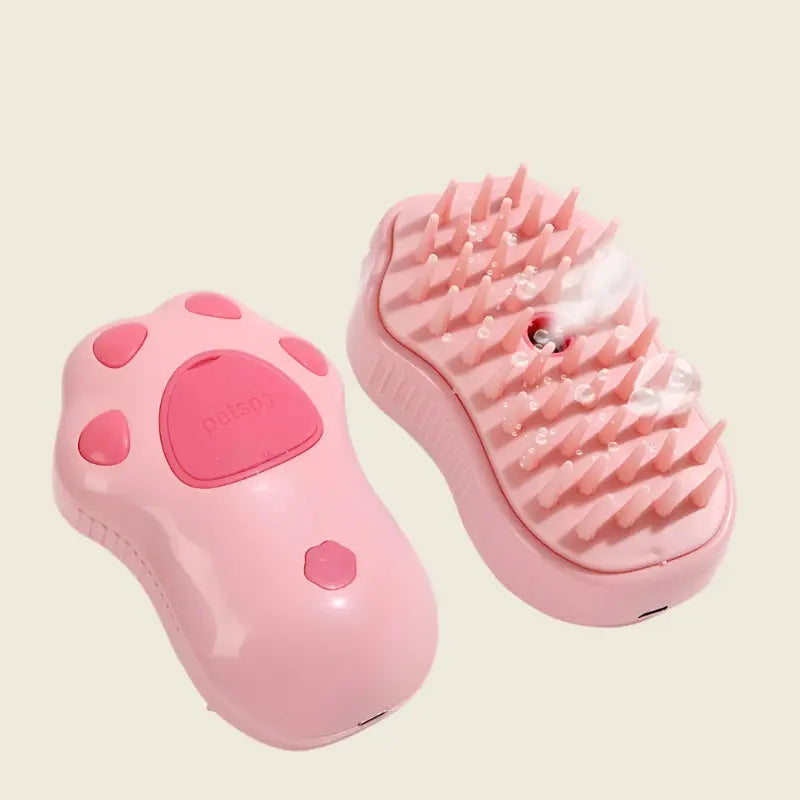 Pink handheld PatteVapeur massage tool with spikes.