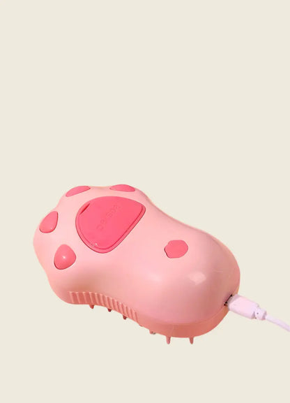 PatteVapeur pink appliance with paw design and USB connection.