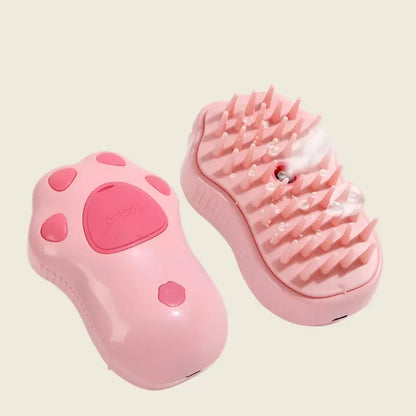 Pink handheld PatteVapeur massage tool with spikes.